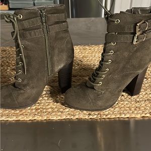 Green heeled combat boots.